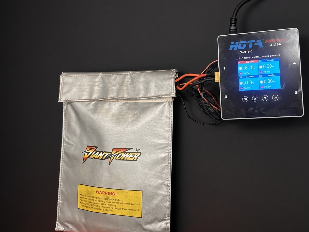 Kevlar LiPo safety bag connected to a HOTA charger